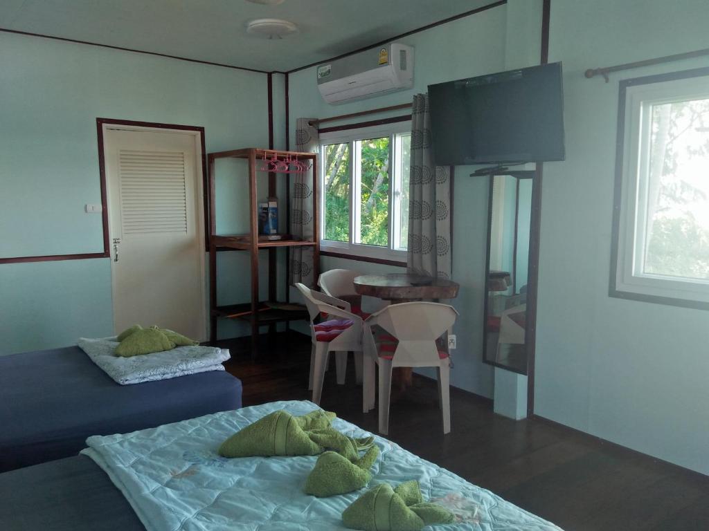 Postel nebo postele na pokoji v ubytování Happy Days Resort