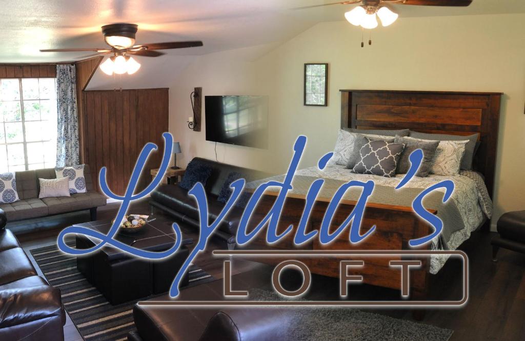 a bedroom with a bed with a sign that reads wildell lodge at Lydias Loft in Ingram