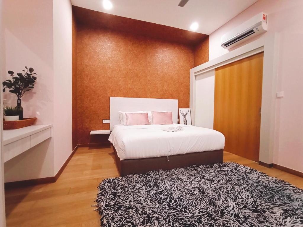 a bedroom with a bed and a black and white rug at Plaza Arkadia Desa Parkcity by KLhomesweet in Kuala Lumpur