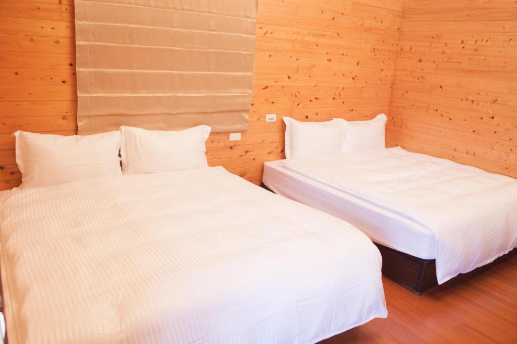 Postel nebo postele na pokoji v ubytování Yellow Mountain Homestay