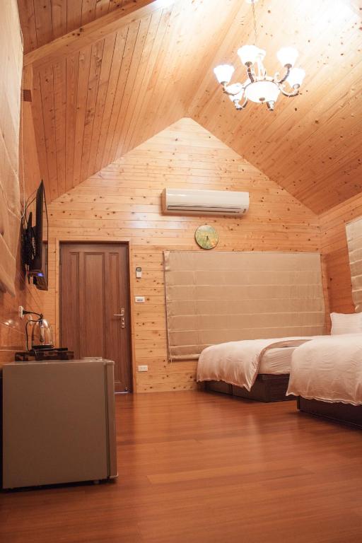 Postel nebo postele na pokoji v ubytování Yellow Mountain Homestay