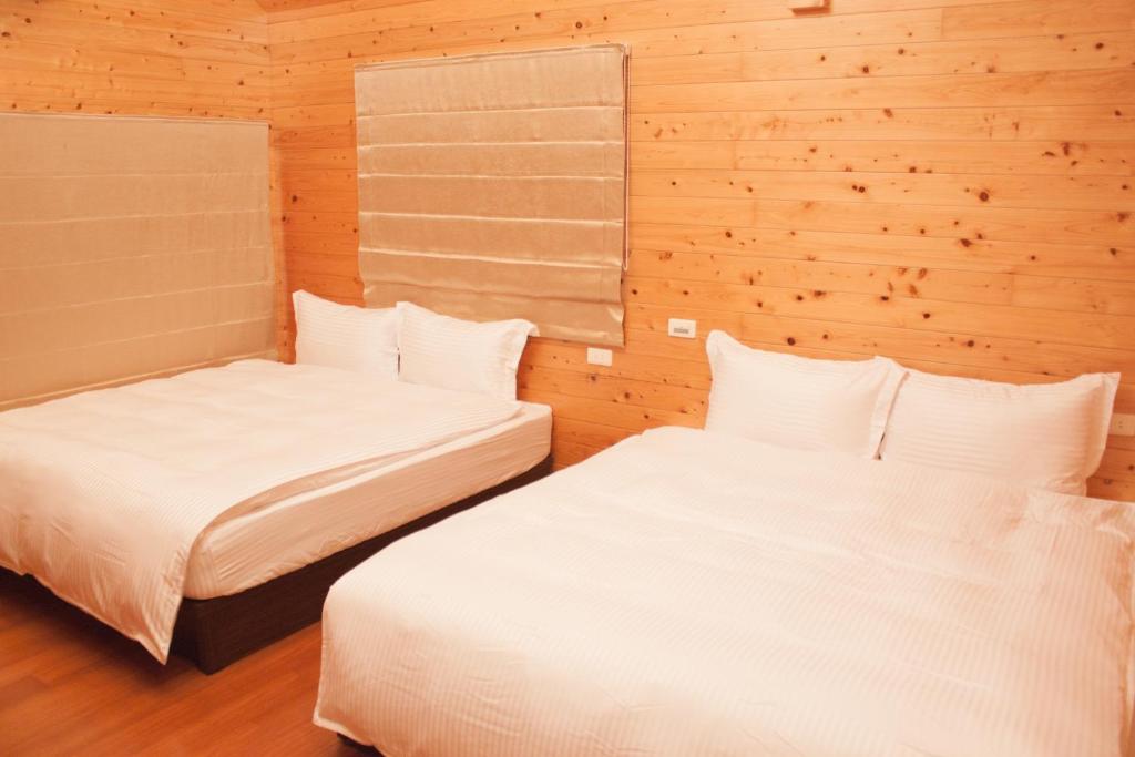Postel nebo postele na pokoji v ubytování Yellow Mountain Homestay
