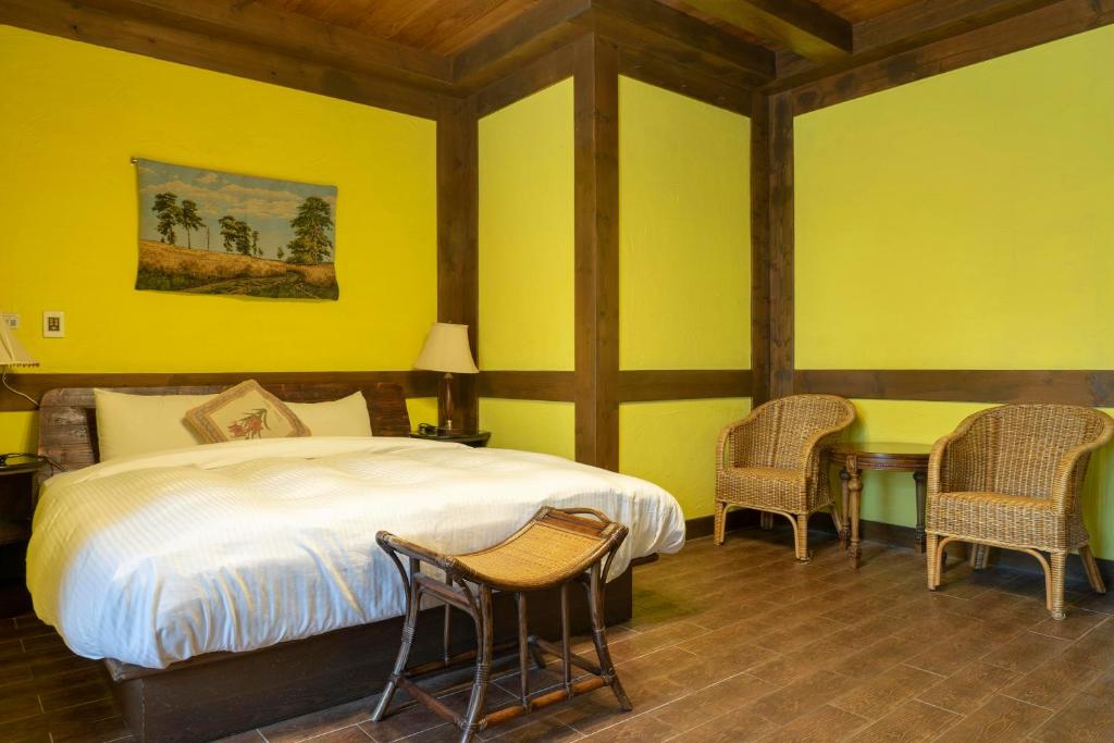 Postel nebo postele na pokoji v ubytování Provence Rose Lodge
