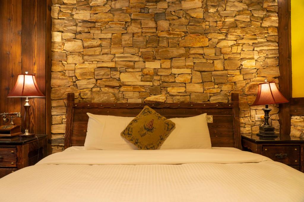 Postel nebo postele na pokoji v ubytování Provence Rose Lodge