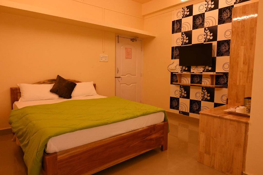 Kanchans Nest I Rooms & Suites near Port Blair Airport 객실 침대