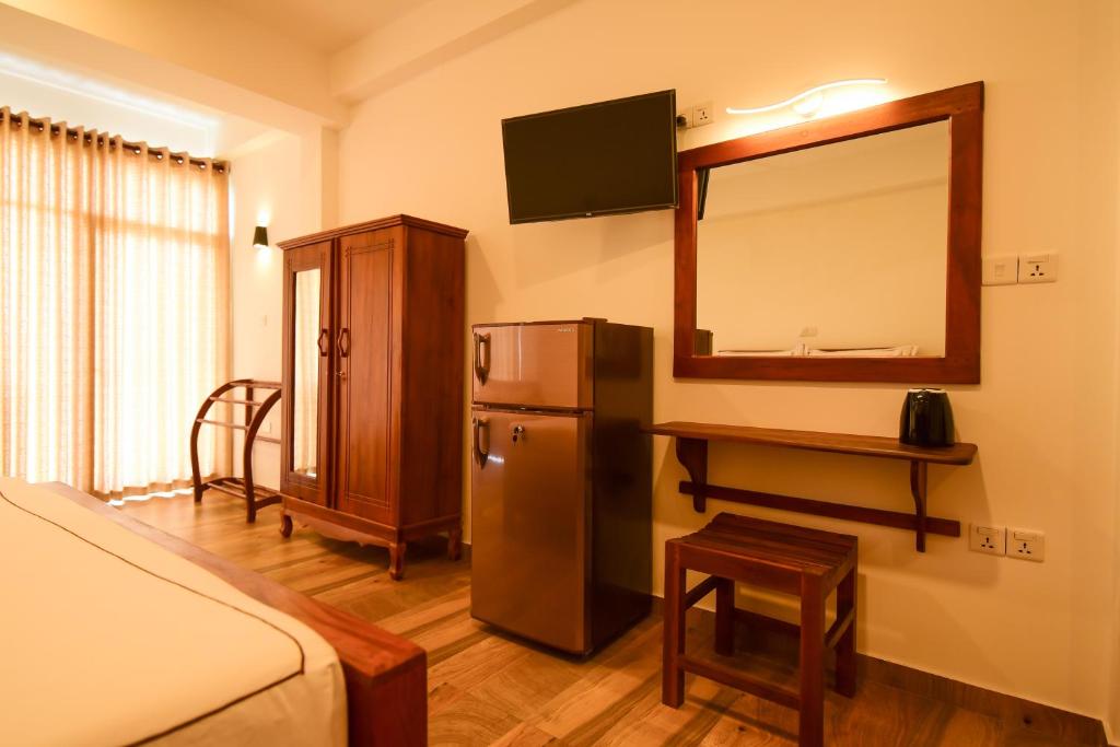 TV a/nebo společenská místnost v ubytování Chaaya inn Hotel