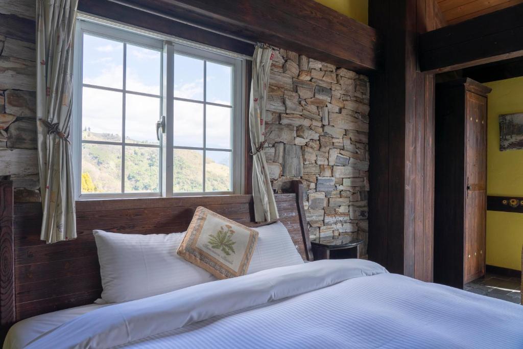 Postel nebo postele na pokoji v ubytování Provence Rose Lodge