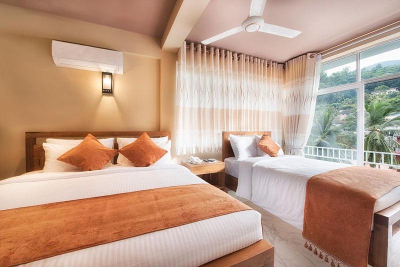 Postel nebo postele na pokoji v ubytování Sobaya Hotel