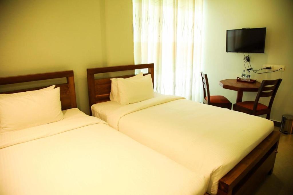 Postel nebo postele na pokoji v ubytování Sobaya Hotel