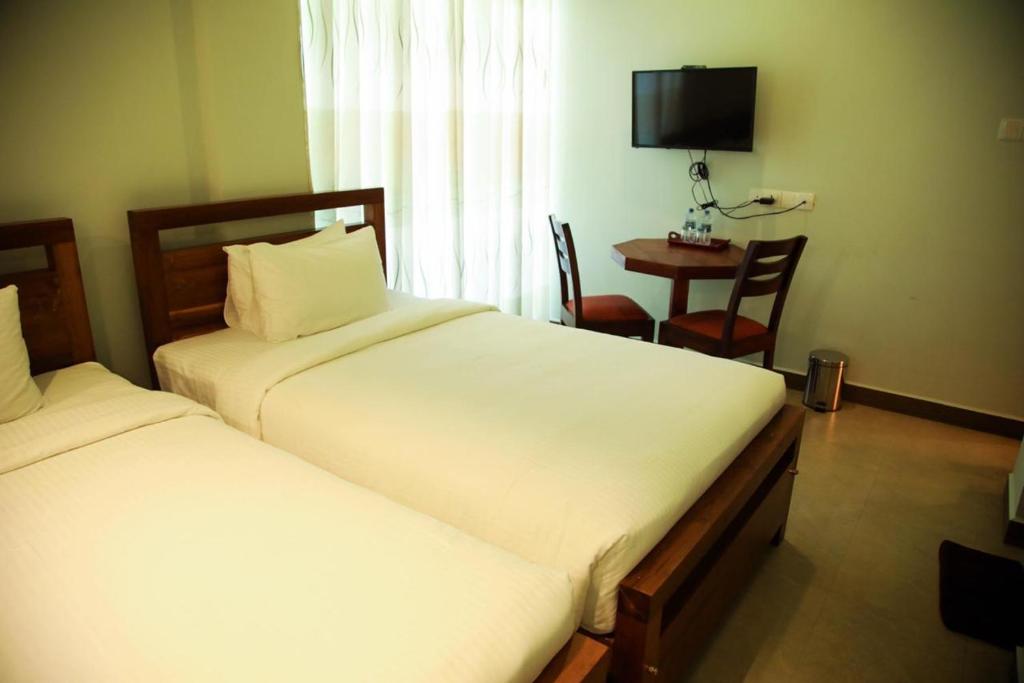 Postel nebo postele na pokoji v ubytování Sobaya Hotel