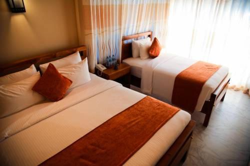 Postel nebo postele na pokoji v ubytování Sobaya Hotel