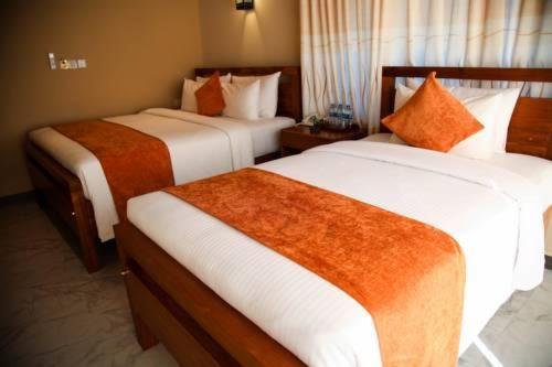Postel nebo postele na pokoji v ubytování Sobaya Hotel