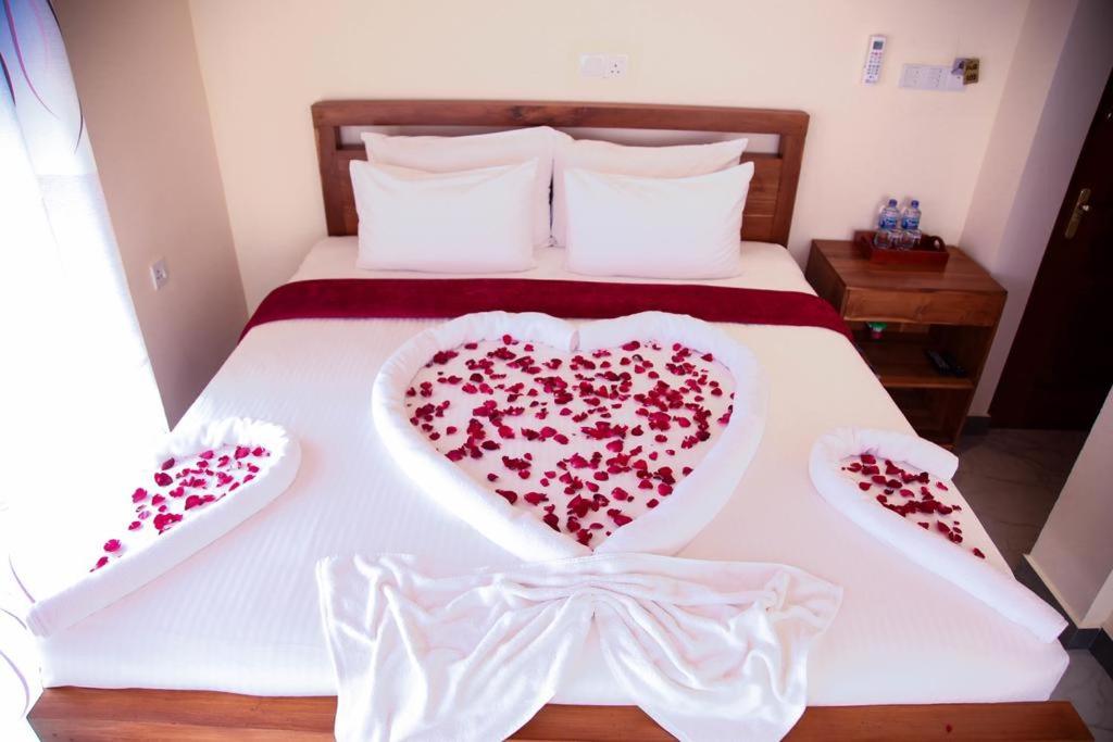 Postel nebo postele na pokoji v ubytování Sobaya Hotel