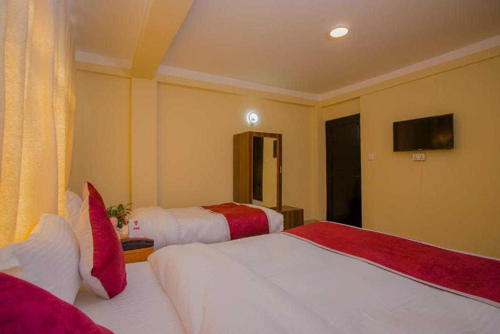 Postel nebo postele na pokoji v ubytování Asha Lodges