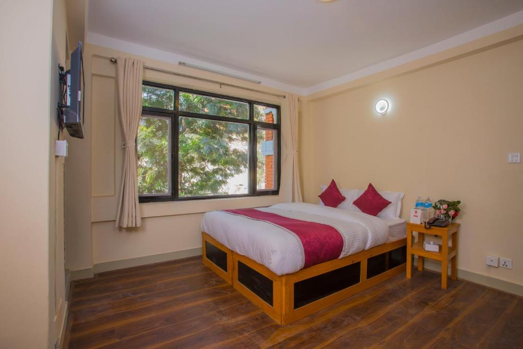 Postel nebo postele na pokoji v ubytování Asha Lodges