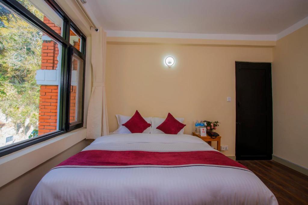 Postel nebo postele na pokoji v ubytování Asha Lodges