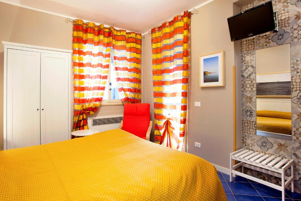 A bed or beds in a room at TerraSole Bakery B&B