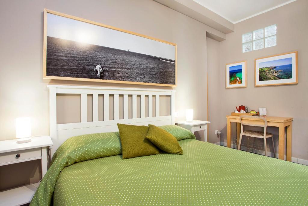 A bed or beds in a room at TerraSole Bakery B&B