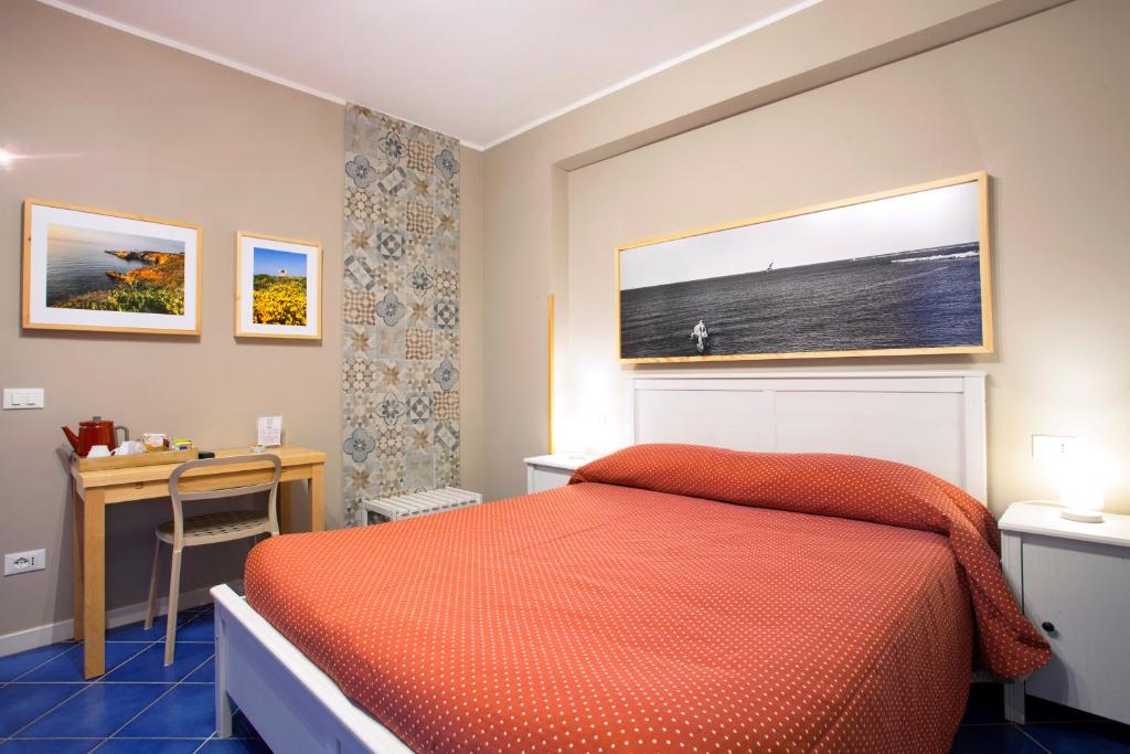 A bed or beds in a room at TerraSole Bakery B&B