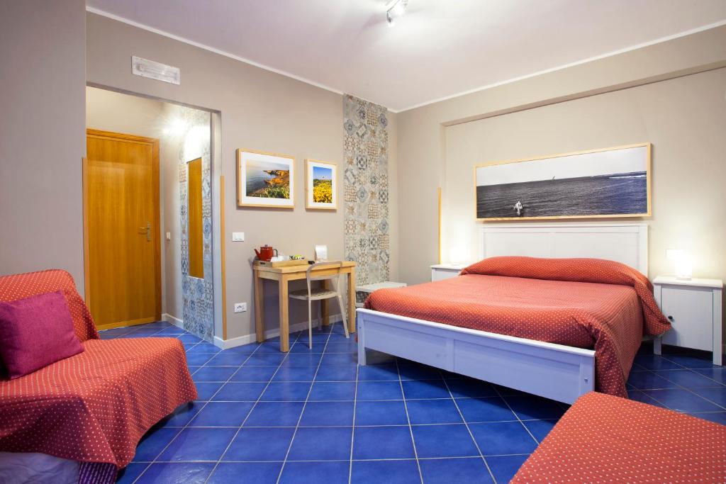 A bed or beds in a room at TerraSole Bakery B&B