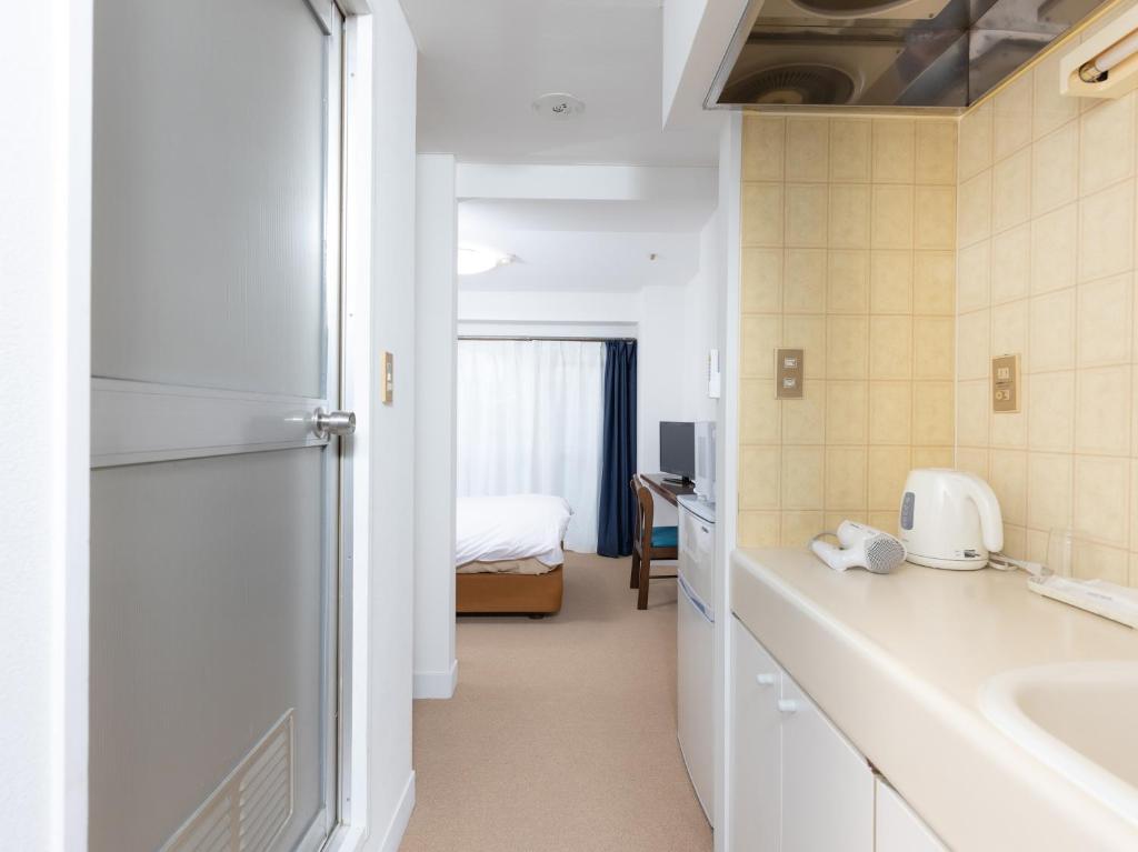 Kuchyň nebo kuchyňský kout v ubytování Hotel WWJ