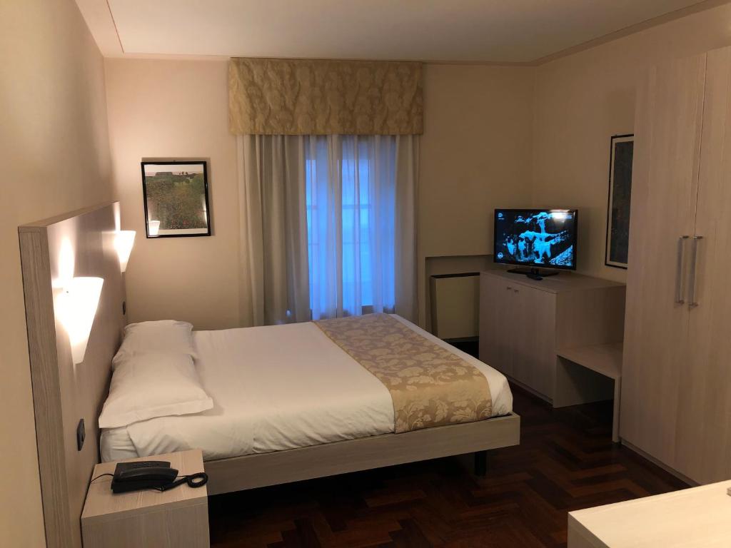 Postel nebo postele na pokoji v ubytování Hotel Boutique Antiche Mura