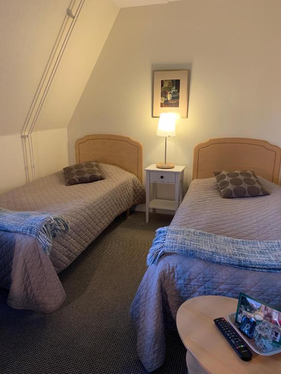 Letto o letti in una camera di Nya Pallas Hotel