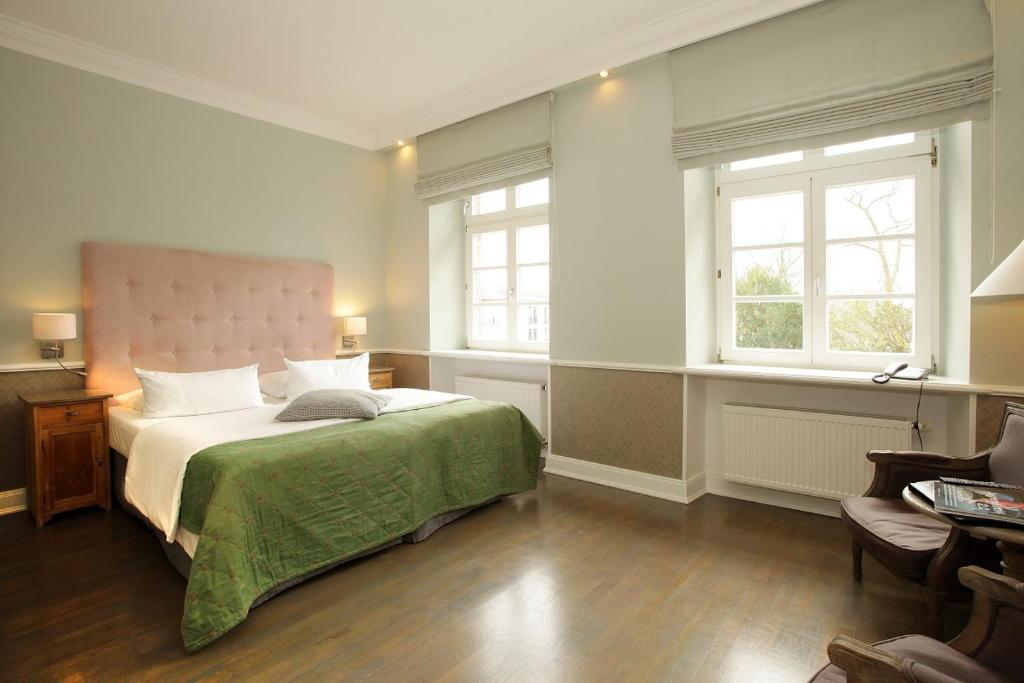 Ein Bett oder Betten in einem Zimmer der Unterkunft Schloss Basthorst