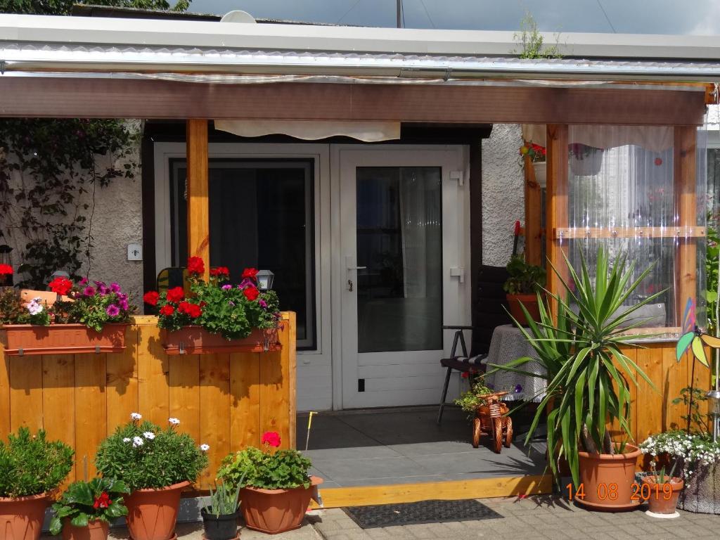 a front door of a house with potted plants at lange in Sassnitz