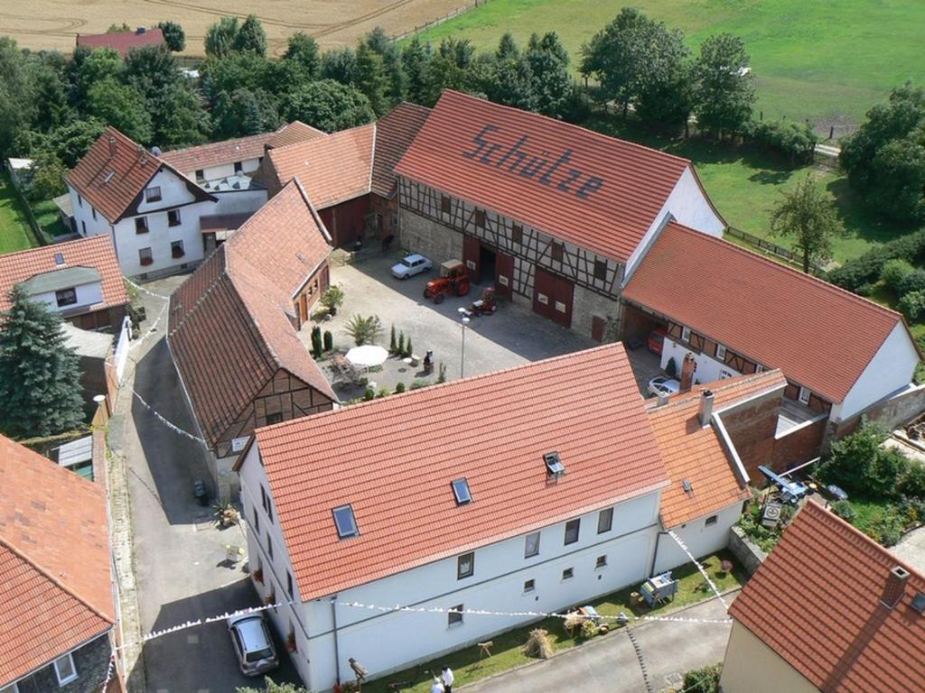 an overhead view of a large building with red roofs at Pension Schütze in Daasdorf am Berge