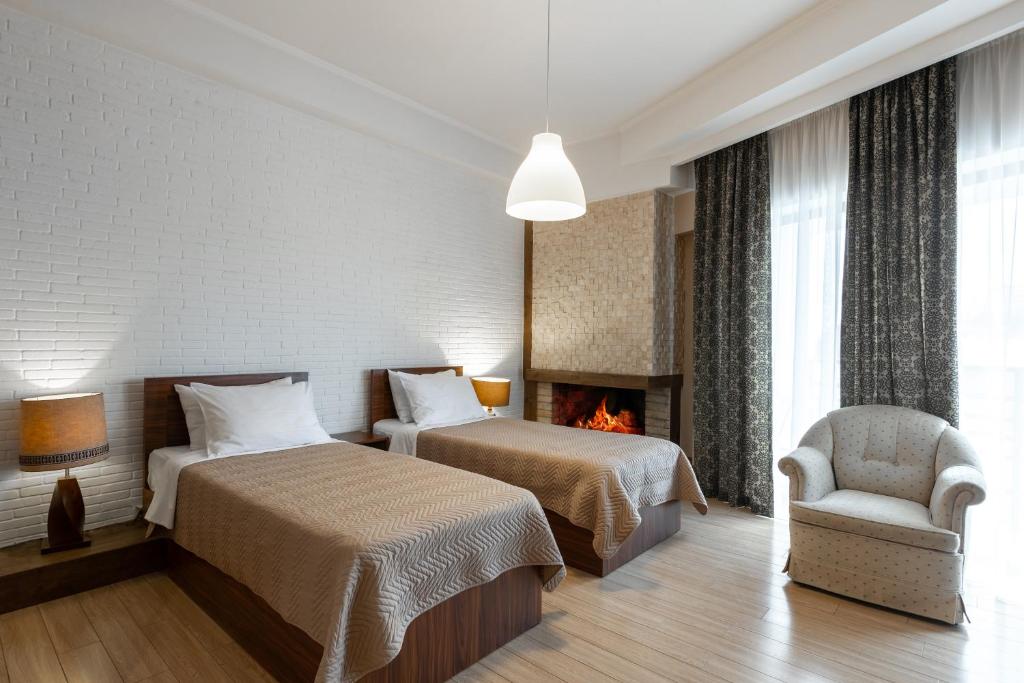 Postel nebo postele na pokoji v ubytování Hotel Libretto