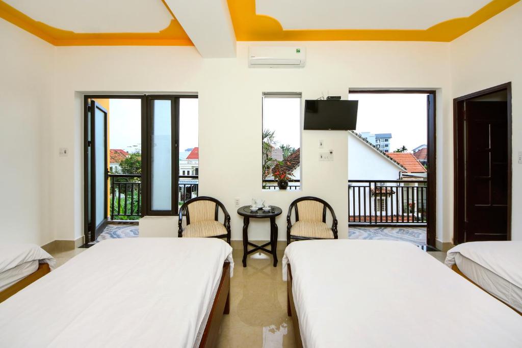 Llit o llits en una habitació de Thinh Phuc Homestay