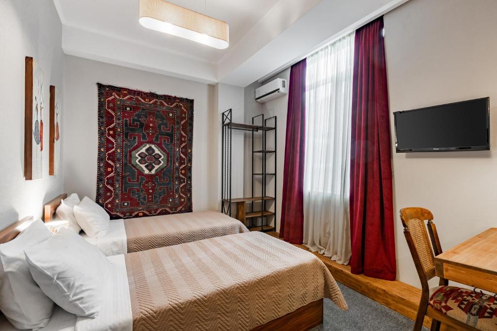 Postel nebo postele na pokoji v ubytování Hotel Libretto