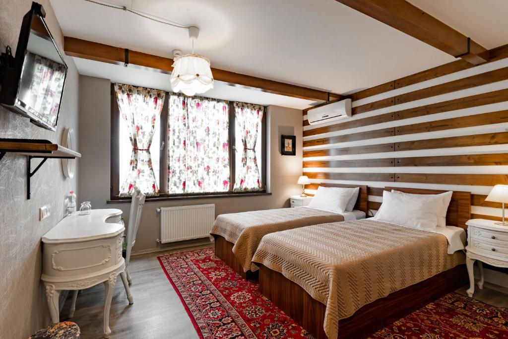 Postel nebo postele na pokoji v ubytování Hotel Libretto