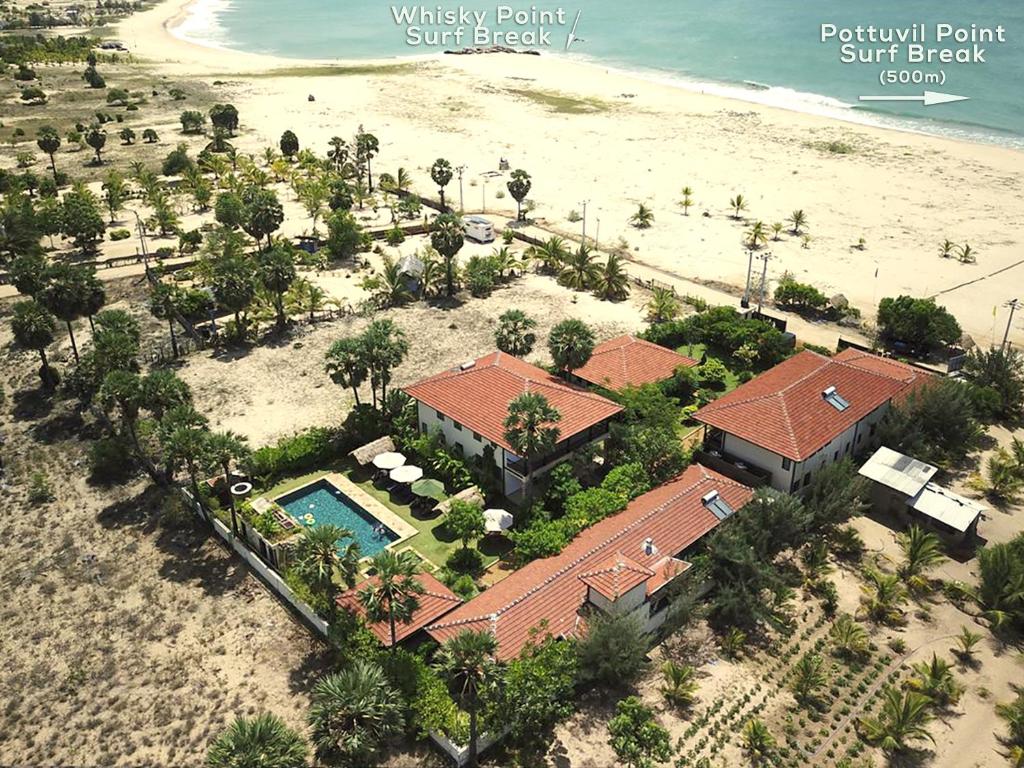 an aerial view of a house next to the beach at Dream Garden in Arugam Bay