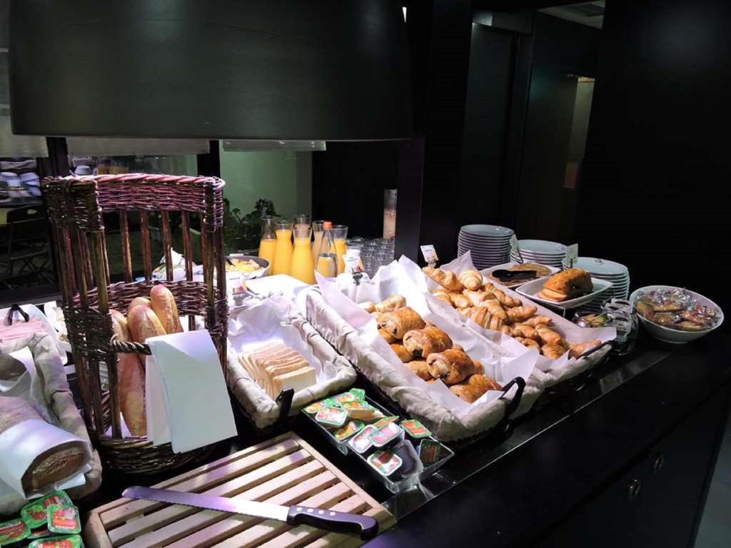 a buffet of pastries and other food on a table at Campanile Toulouse Sud-Labège innopole in Labège