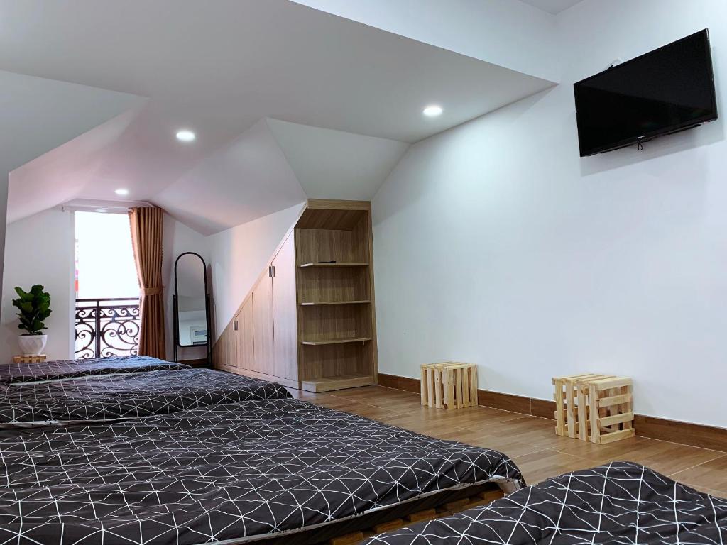 Postel nebo postele na pokoji v ubytování Trang Nguyen House