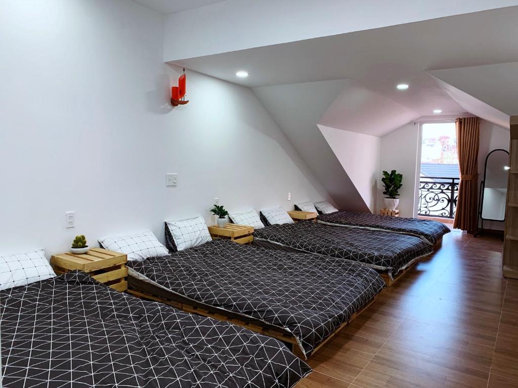 Postel nebo postele na pokoji v ubytování Trang Nguyen House