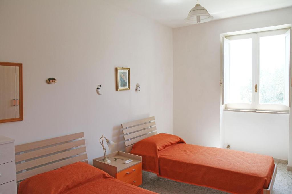 Postel nebo postele na pokoji v ubytování Villetta rustica di campagna