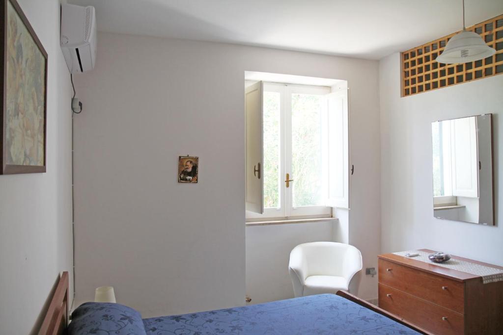 Postel nebo postele na pokoji v ubytování Villetta rustica di campagna