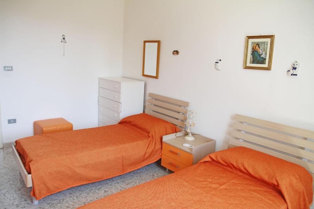 Postel nebo postele na pokoji v ubytování Villetta rustica di campagna