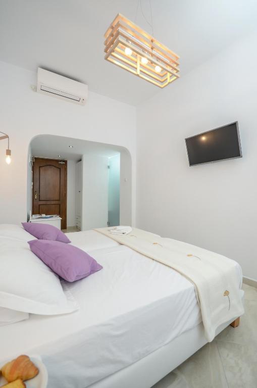 Postel nebo postele na pokoji v ubytování Hotel Anixis