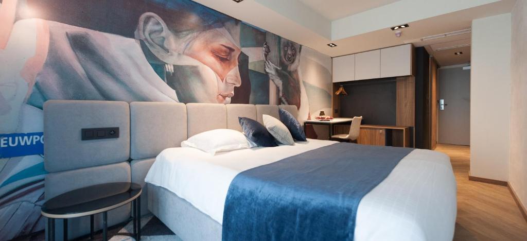Postel nebo postele na pokoji v ubytování Ostend Hotel
