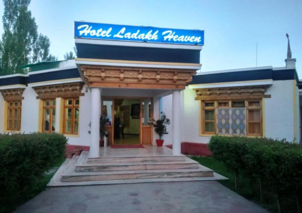 a building with a sign on the front of it at Hotel Ladakh Heaven in Leh