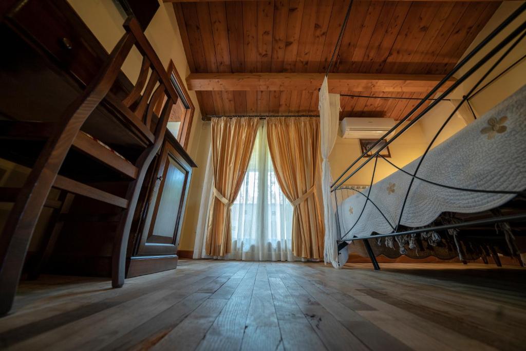 Agriturismo La Ginestra - Deluxe Dreibettzimmer