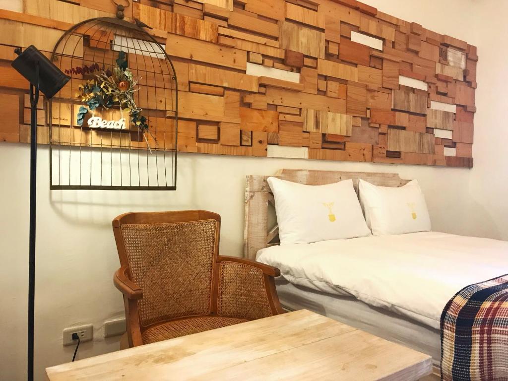 Postel nebo postele na pokoji v ubytování 墾丁寵物友善 鐵宿 Tetsu B&B