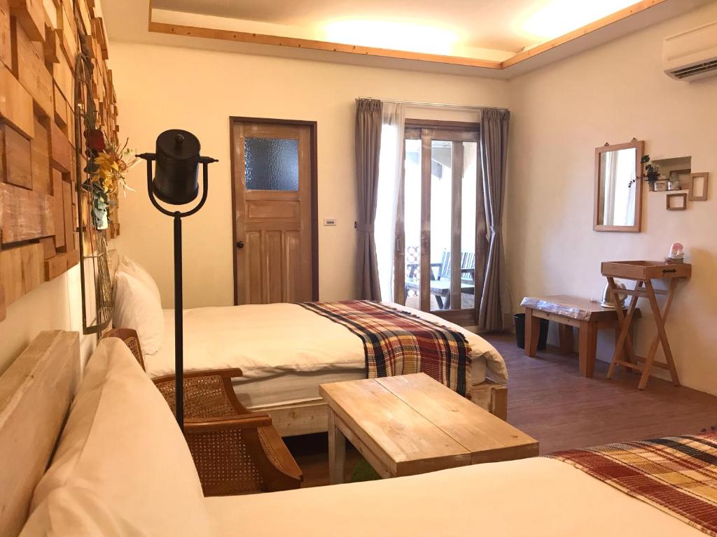 Postel nebo postele na pokoji v ubytování 墾丁寵物友善 鐵宿 Tetsu B&B