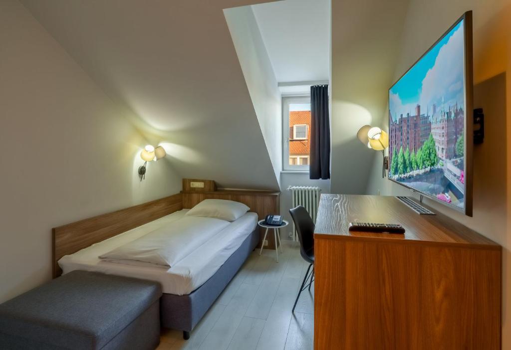 TV a/nebo společenská místnost v ubytování Hotel Astor