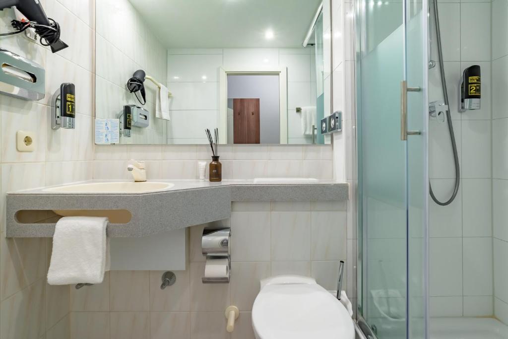 Koupelna v ubytování Hotel Astor