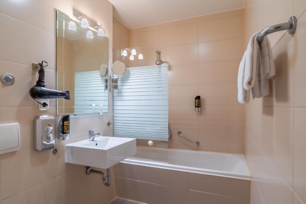 Koupelna v ubytování Hotel Astor